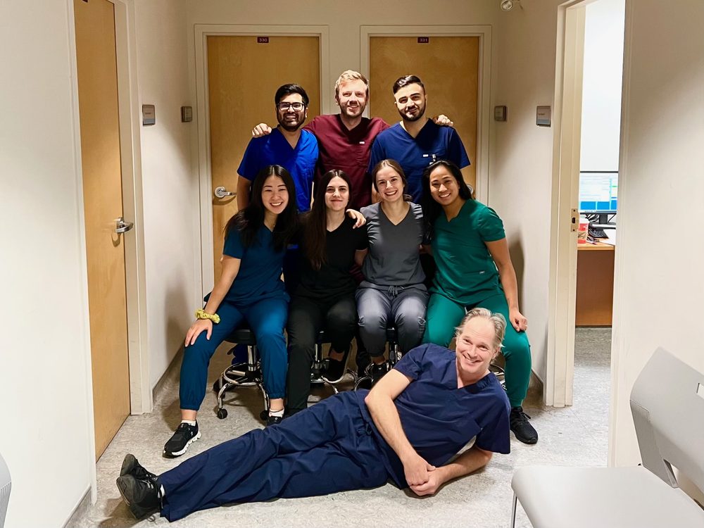 Dr. Maia with a group of colleagues in scrubs