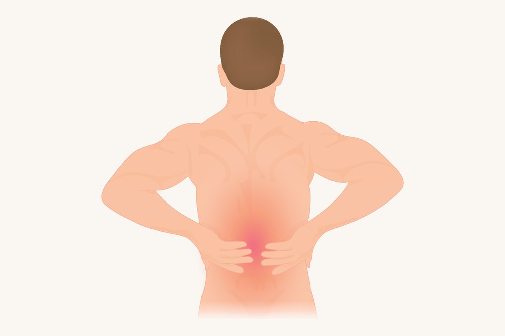 A figure from behind with both hands on the lower back, the sore spot marked